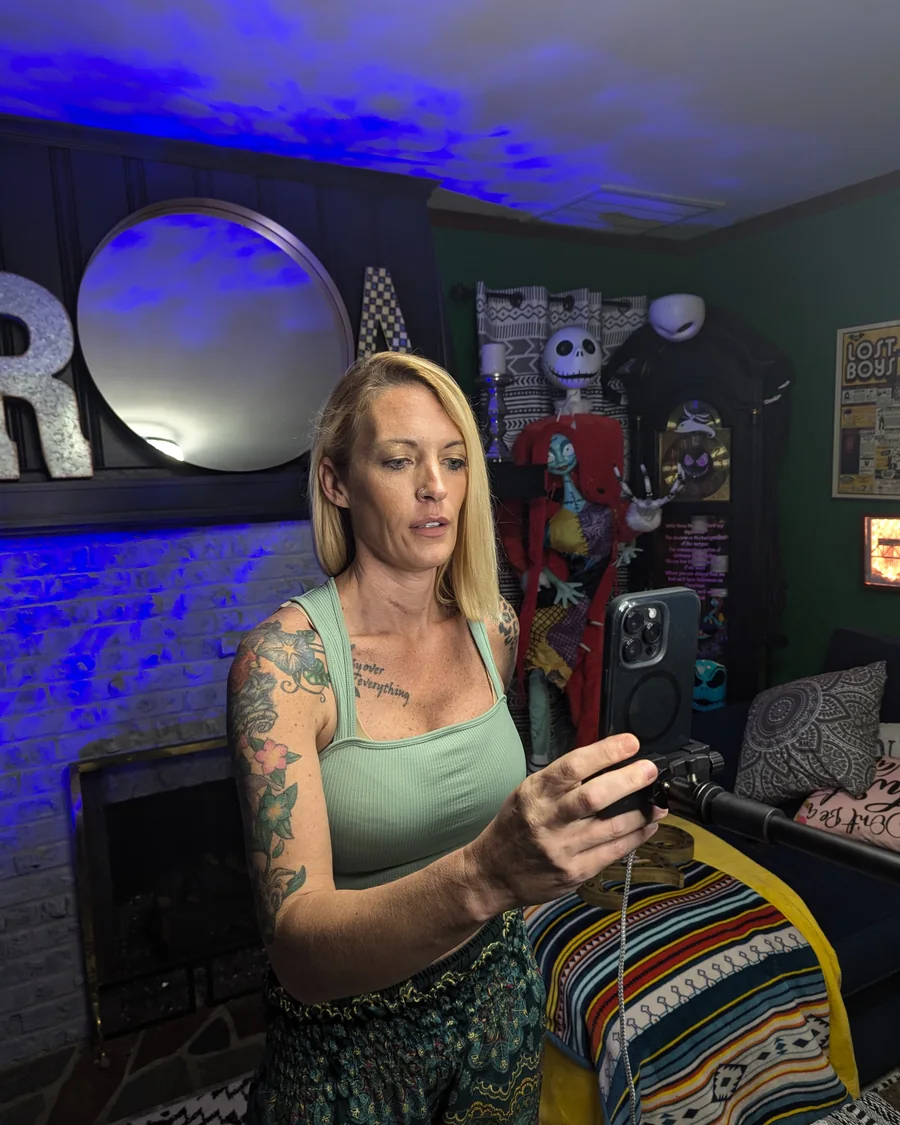 Amy filming in a home studio